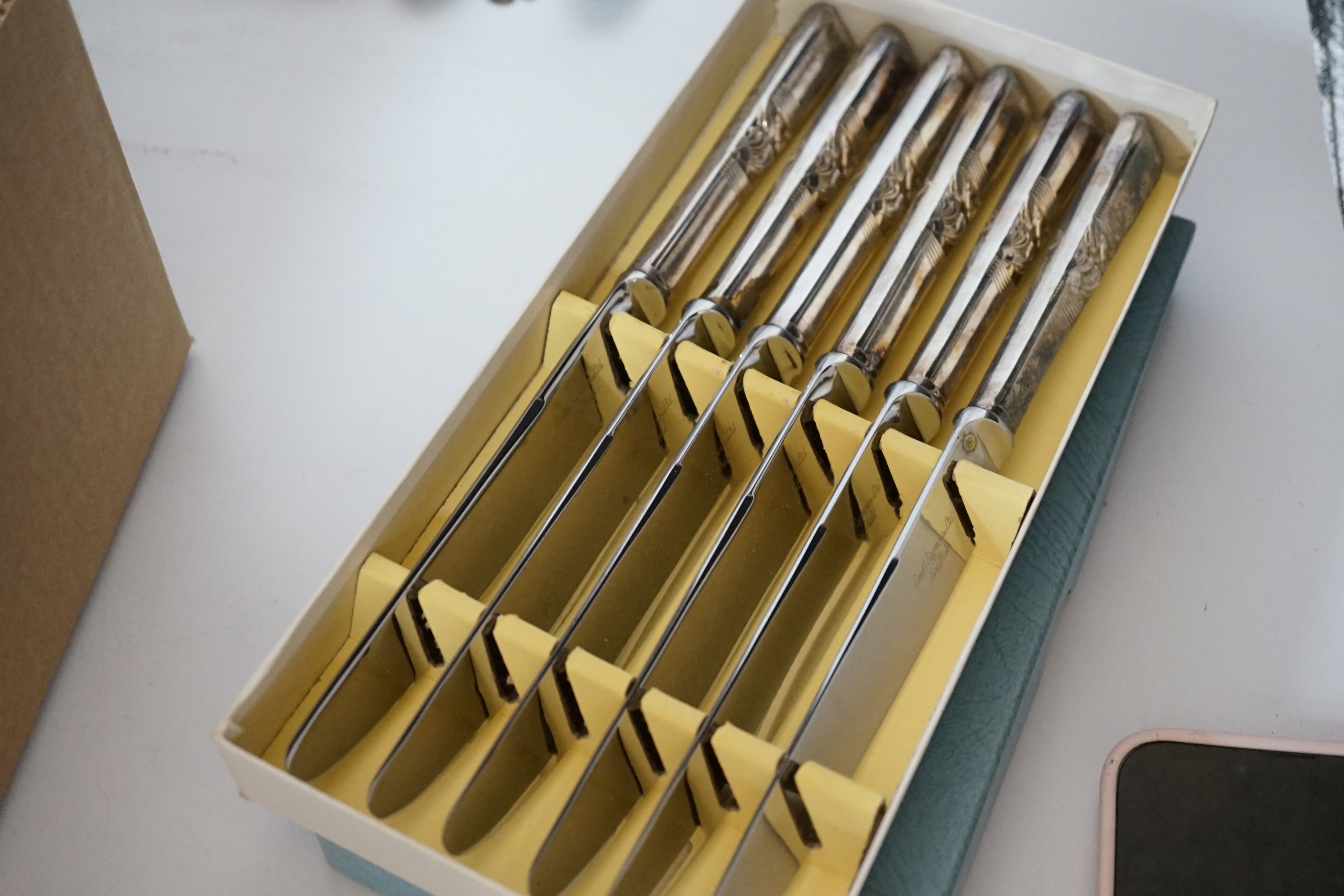 Assorted plated flatware and three silver commemorative spoons